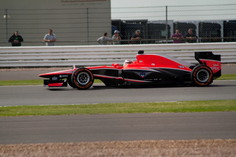 a racing car with an open top drives down the race track