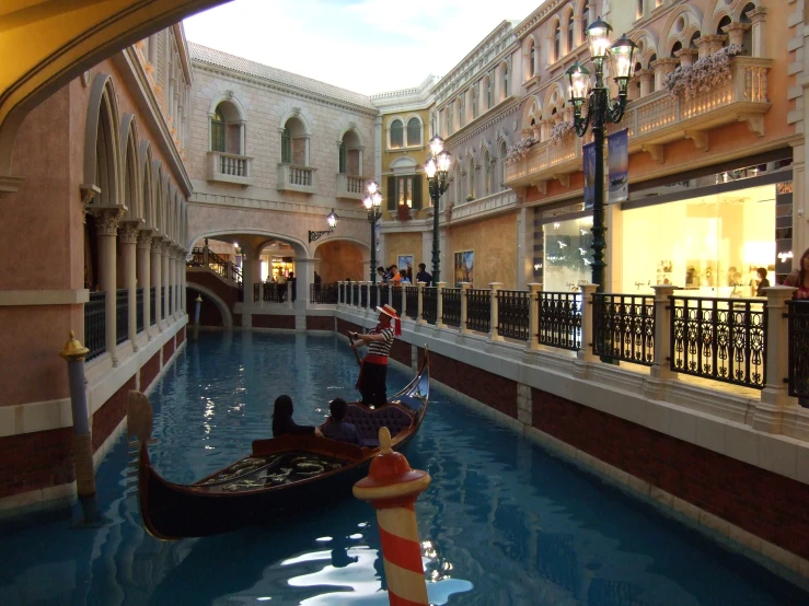 two gondola in the canal near a building