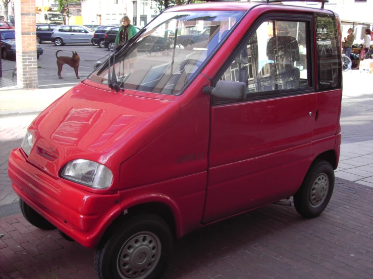 an electric vehicle is sitting on the sidewalk