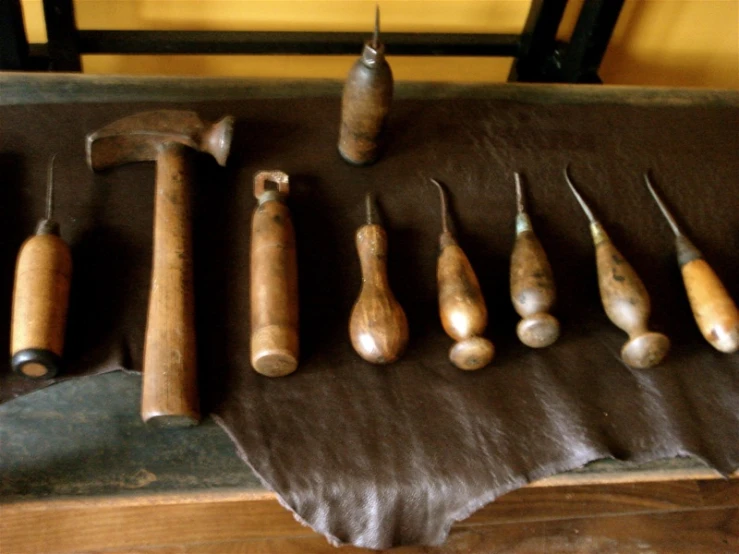 an old tool set with other tools laying on the counter