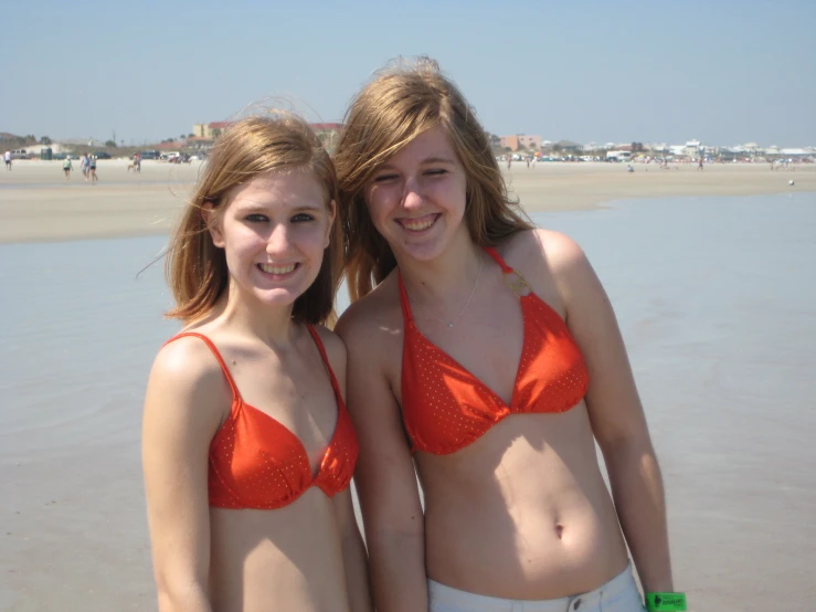 two girls in matching bikinis on the beach