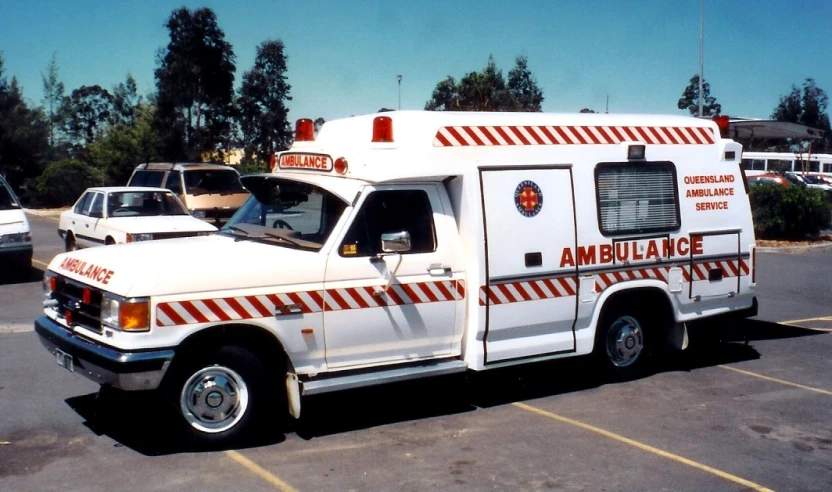 an ambulance truck parked in a parking lot