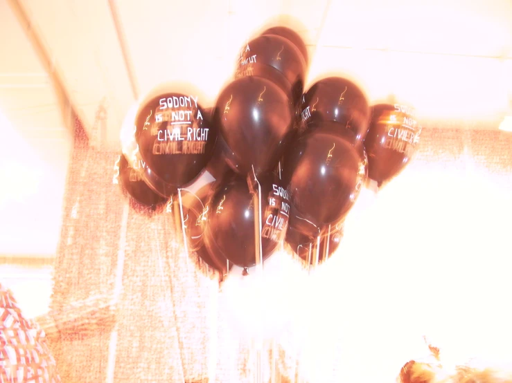 some balloons with graduation lettering hanging in the air