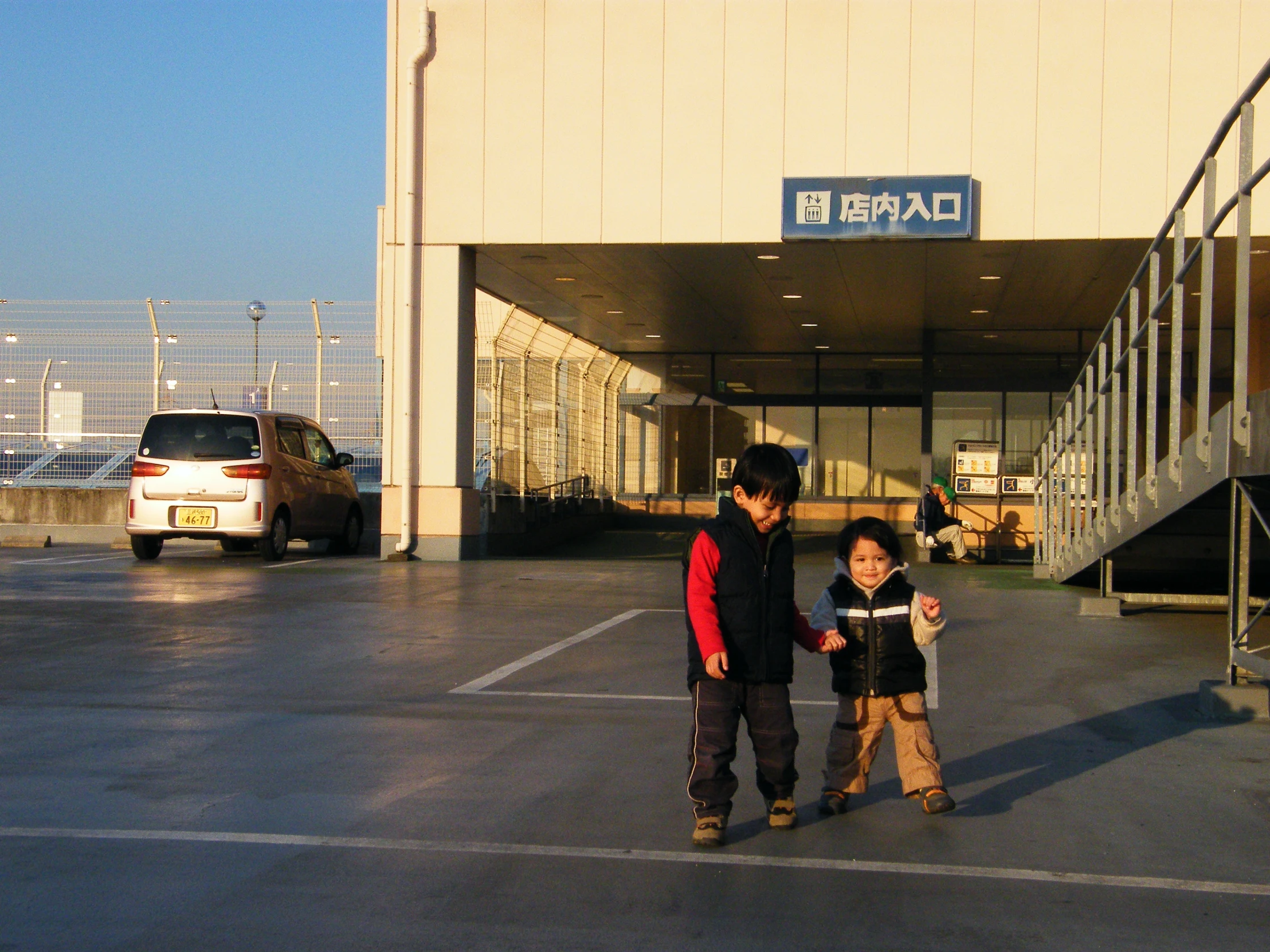 a man and  standing outside of a building