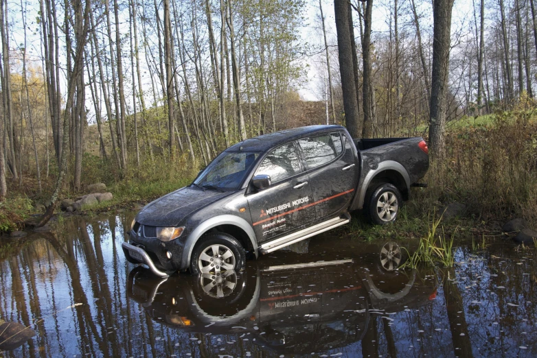 a jeep that is driving through the water