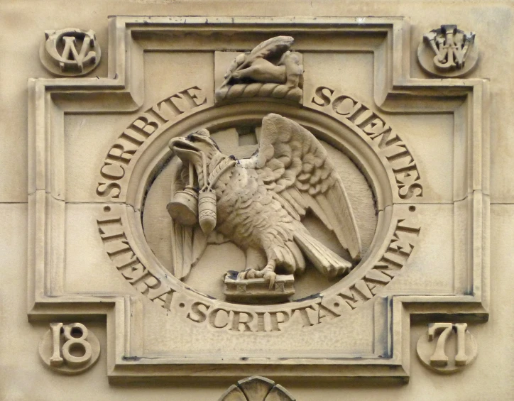 a crest is seen on the side of a building
