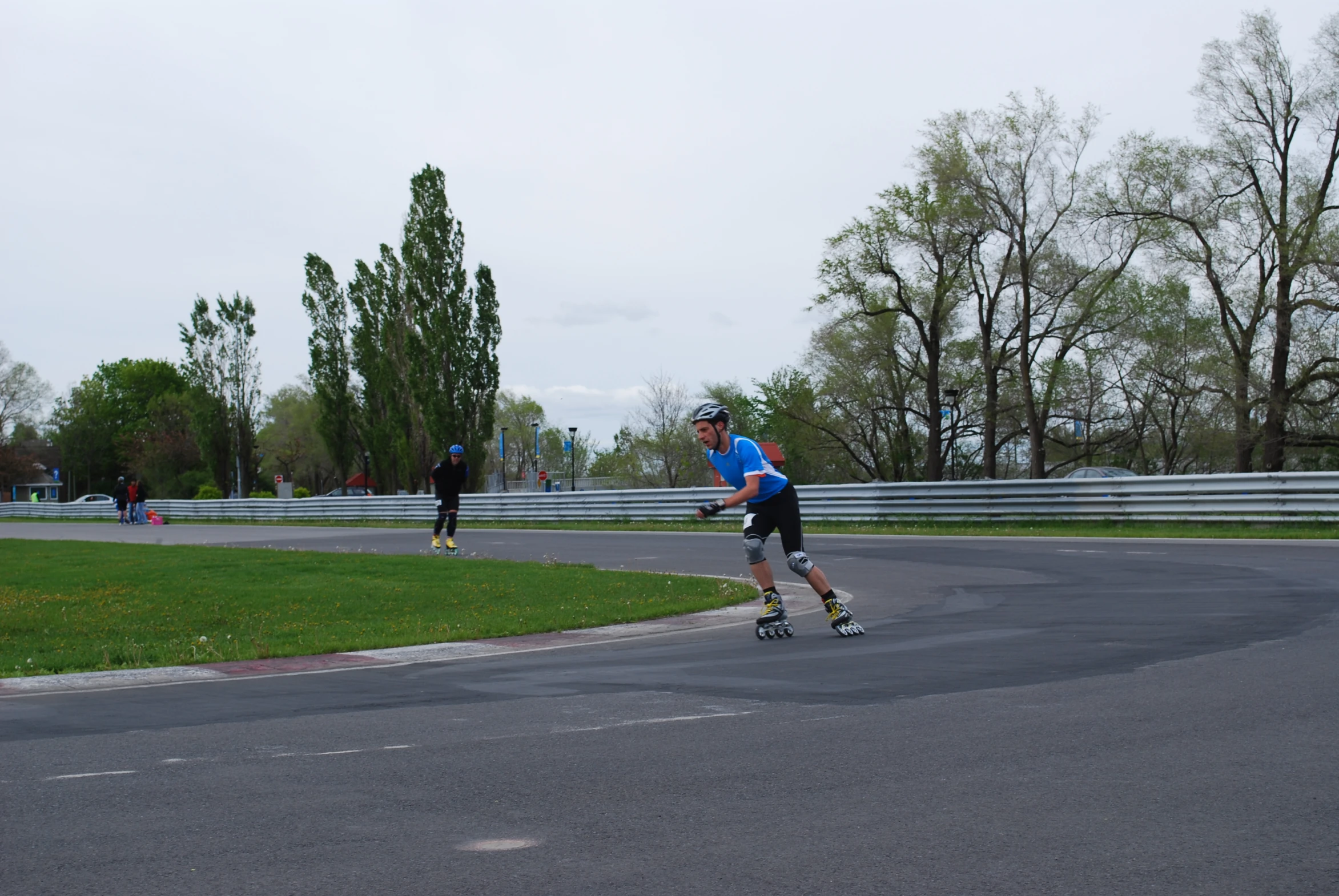 two skate boarders at an outdoor skate park