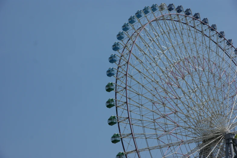 a ferris wheel with many bells on top of it