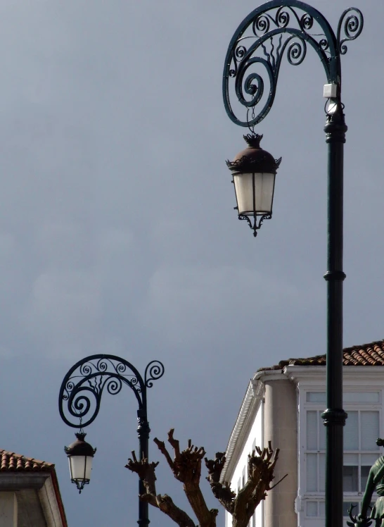 some street lights are next to two building