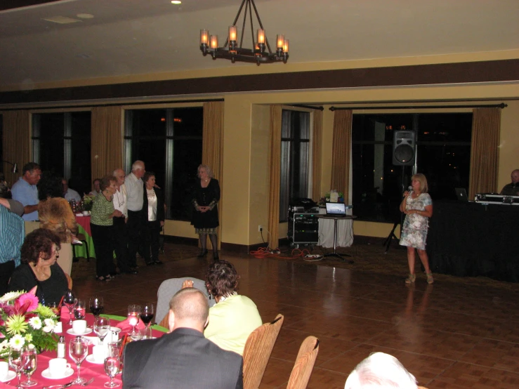 people at a formal gathering having food and dancing