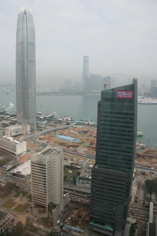 city in view on a cloudy day with skyscrs