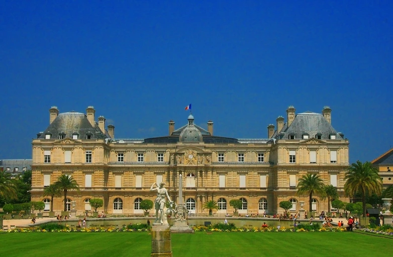 a castle like building is in a grassy field