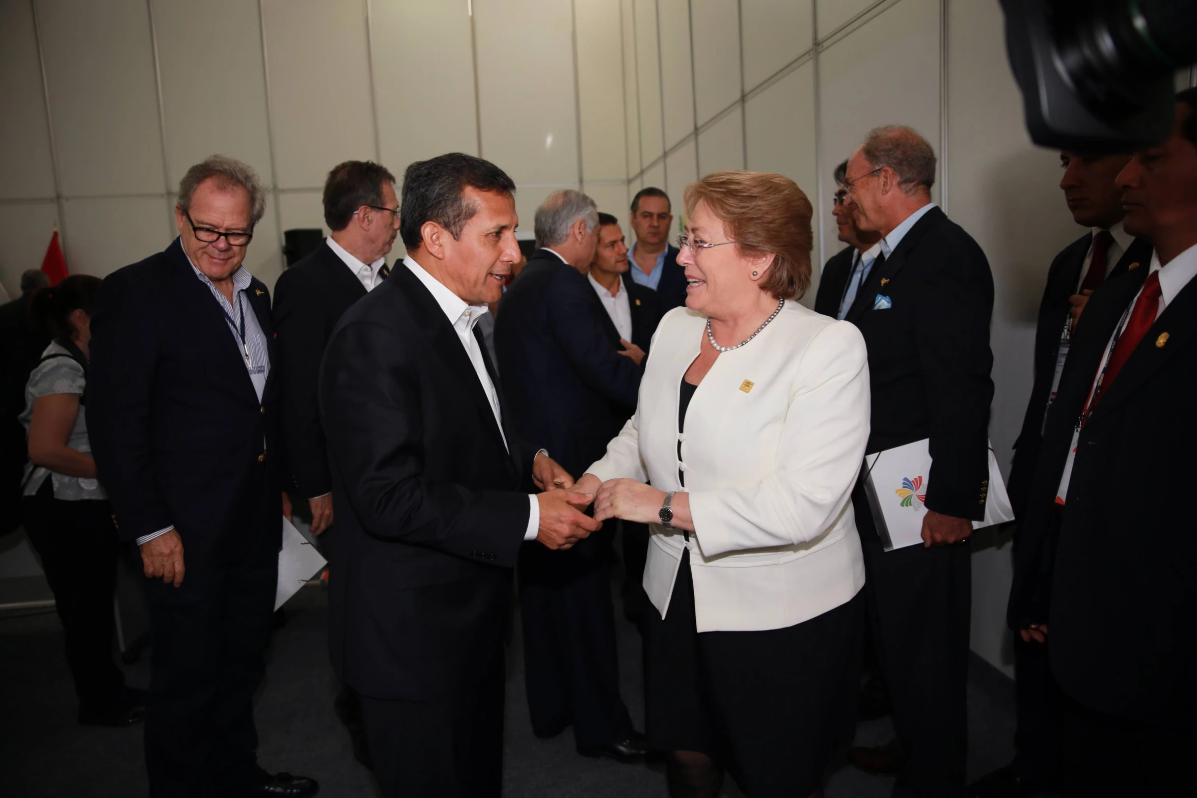 a business meeting for people in suits shaking hands