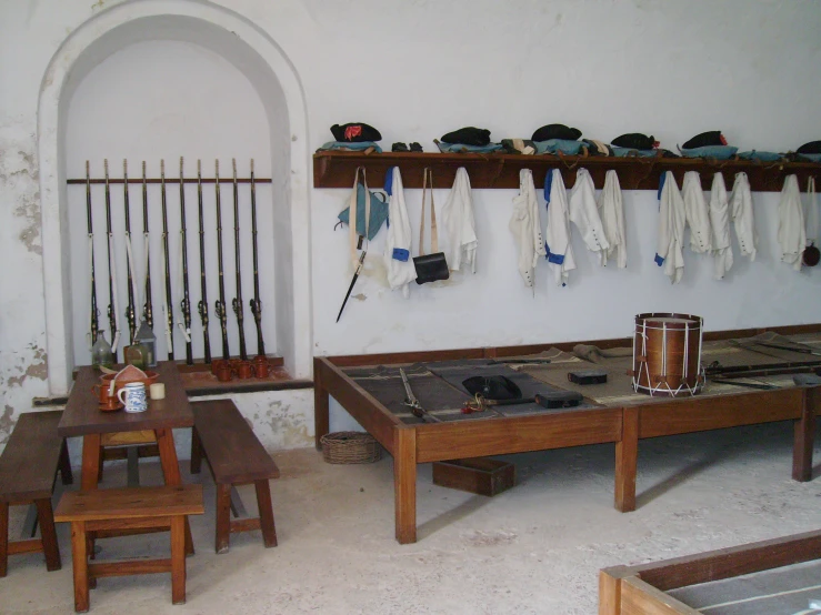 the wooden tables are covered with white blankets