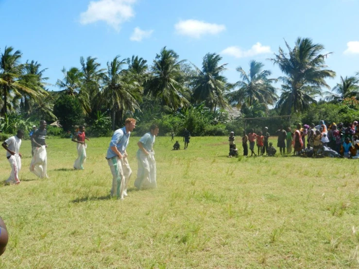 a group of people wearing costumes are playing frisbee in a field