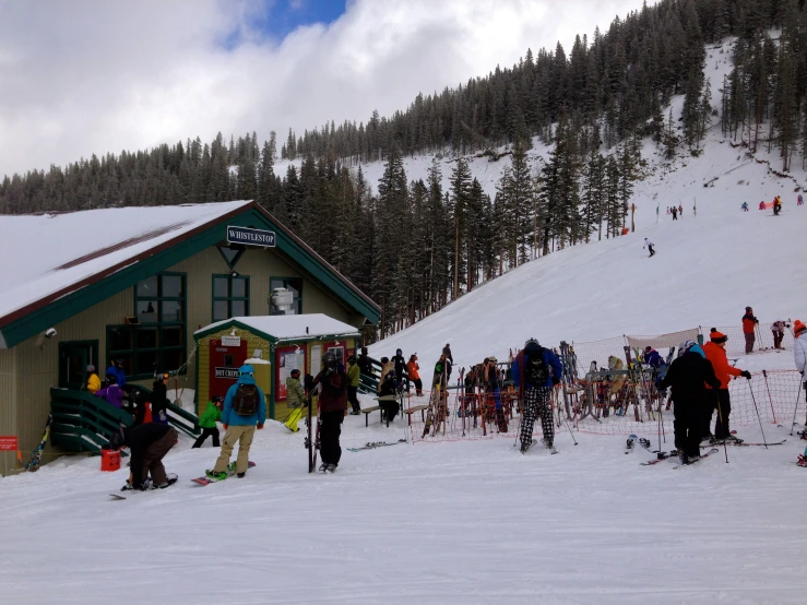 many skiers waiting to get on their ski lift