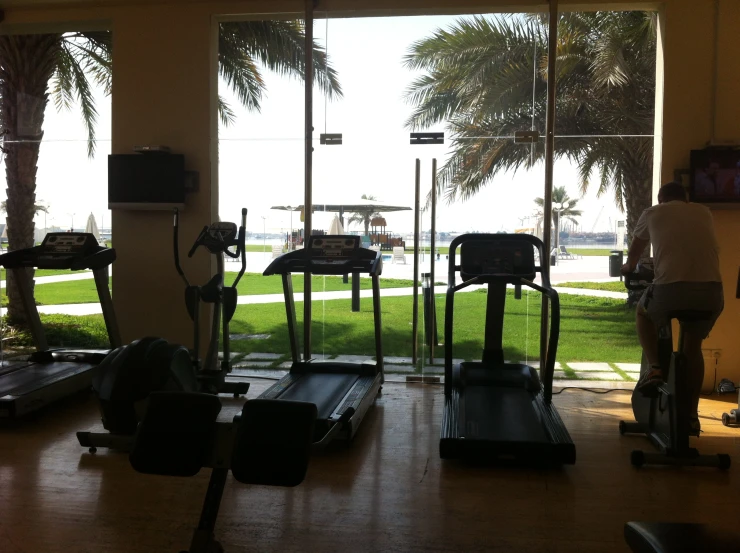 a gym room with various exercise equipment on it