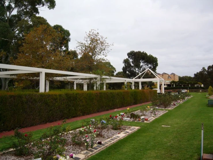 a long row of white arbors at a house