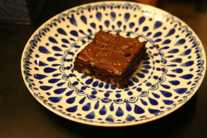 a close up of a plate with cake on a table