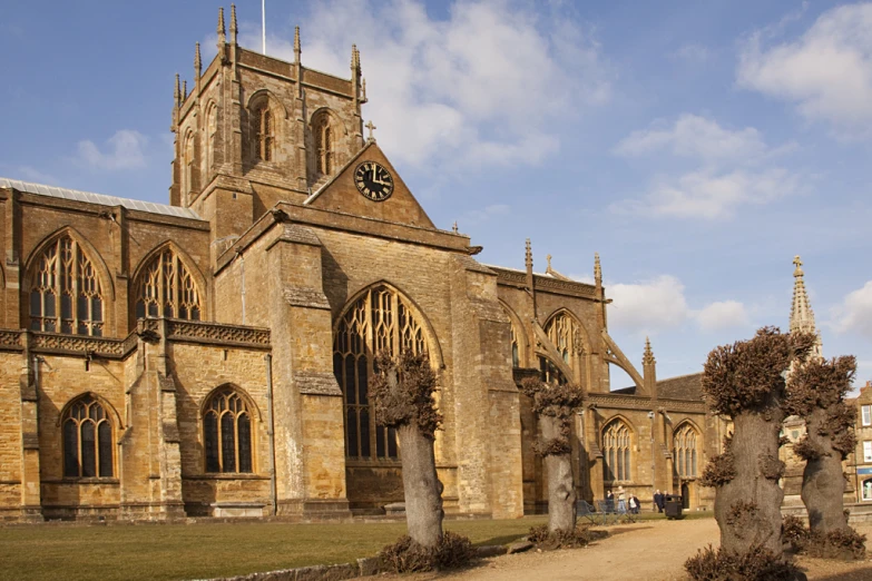 an old church that is next to some very large building