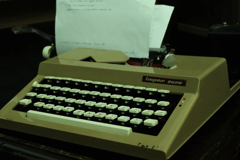 an old computer and some paper sitting on top of it