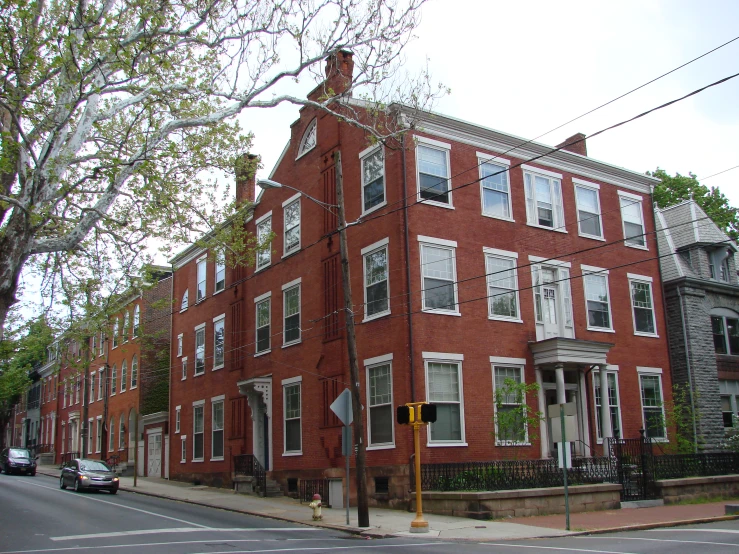 the red brick buildings have many windows on them