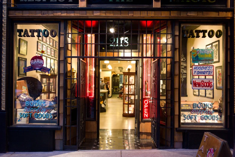 a shop front that has signs in red light