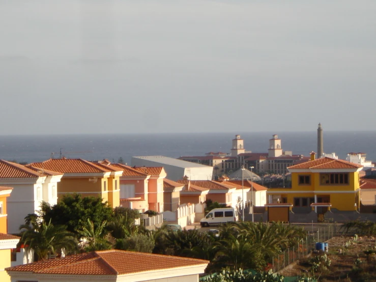 a view of a beach with houses and ocean