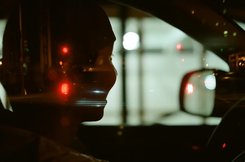 a rear view mirror showing the side view of a car