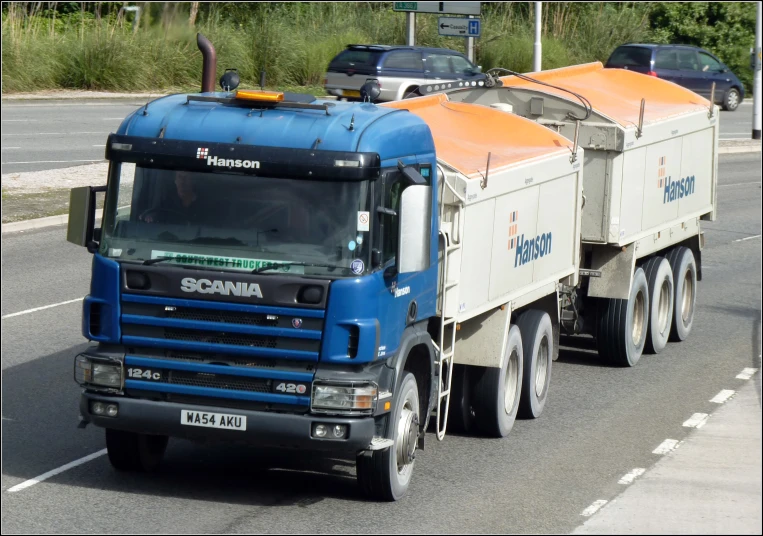 there is a large truck that is driving down the road