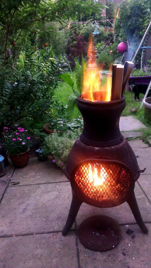 a decorative stove with fire on the bottom