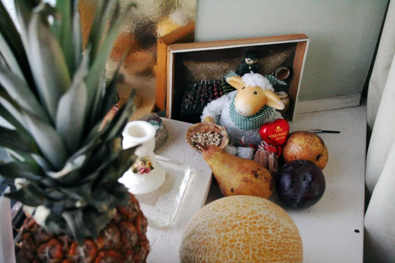 a variety of food and a framed po on a table