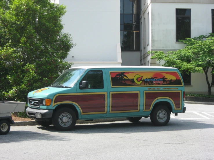 an empty colorful van parked on a street