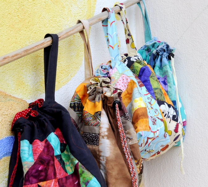 a rack with bags on it hanging from a wall