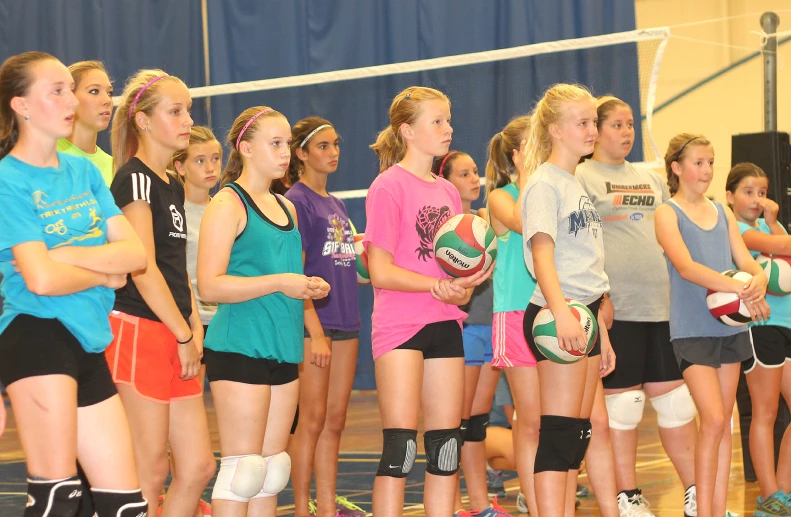 girls lined up for a game of volleyball