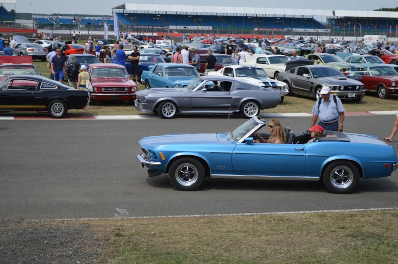 a group of people gathered together in a large parking lot