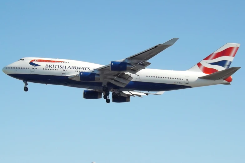 a british airways plane flies through the air