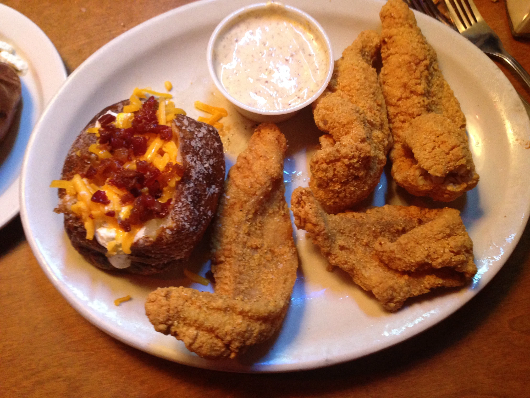 an image of a meal that includes fried fish