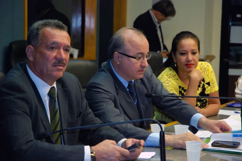 several business people in the background at a meeting