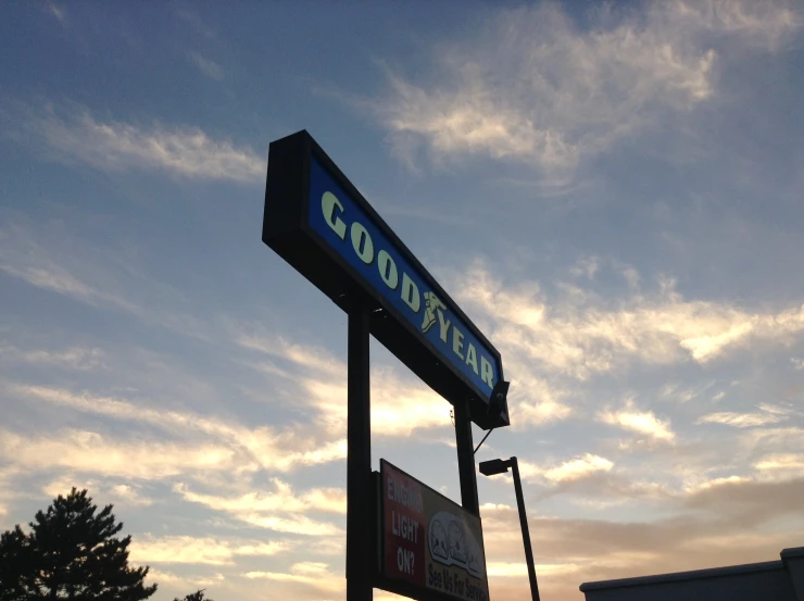 a sign on the outside of a business building that says goodyear