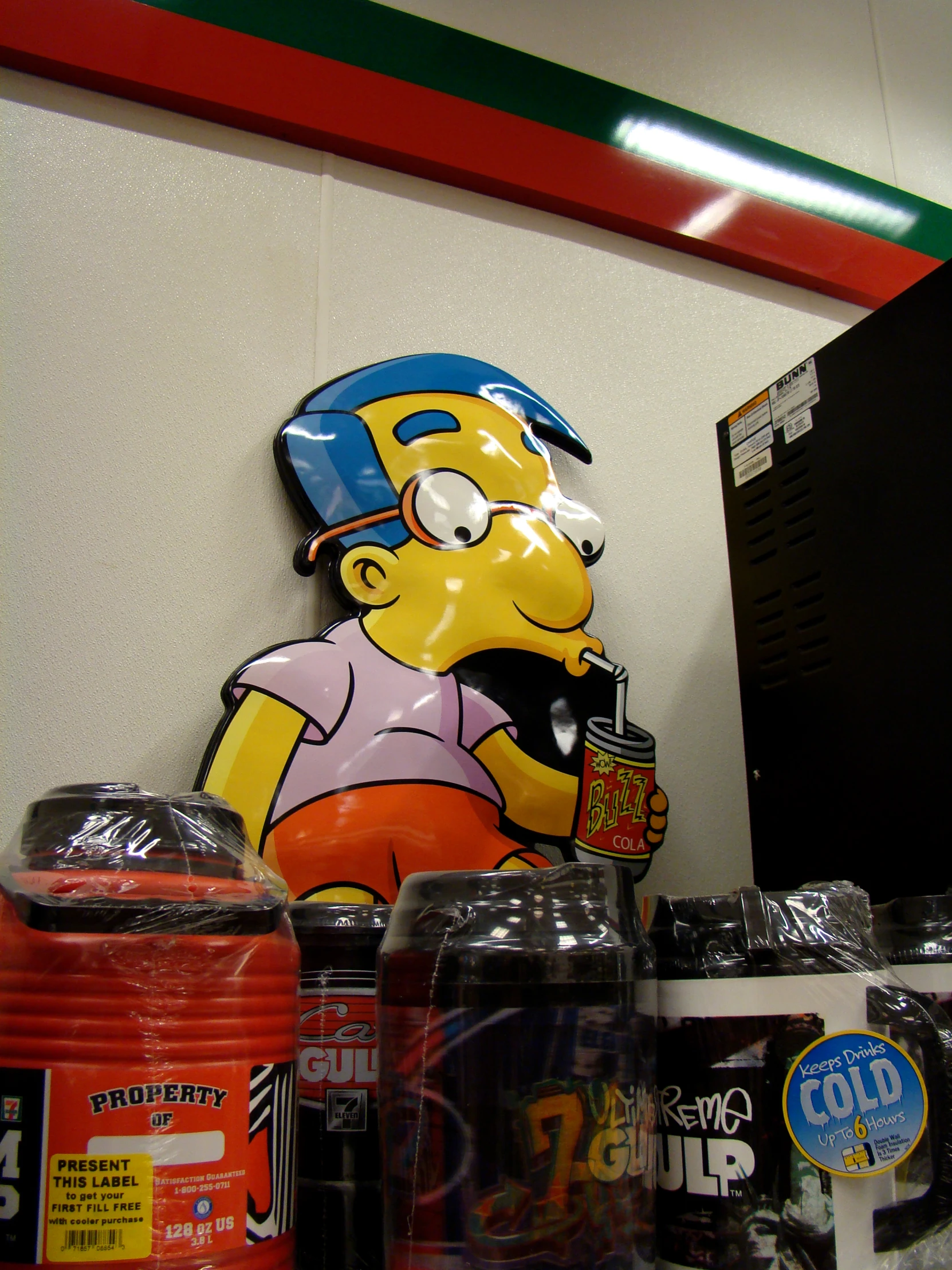 a cartoon homer the simpsons character next to cans of sodas