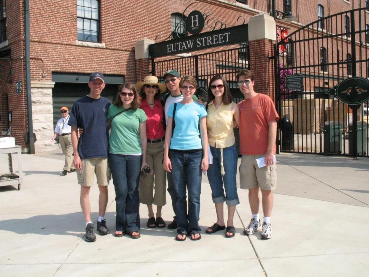 a group of people standing together on a city street