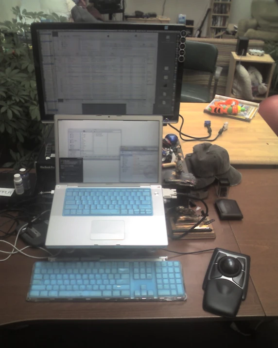 a couple of laptops are sitting on the desk