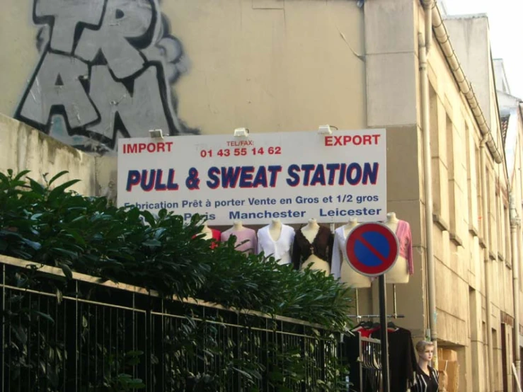 street signs near the side of a building