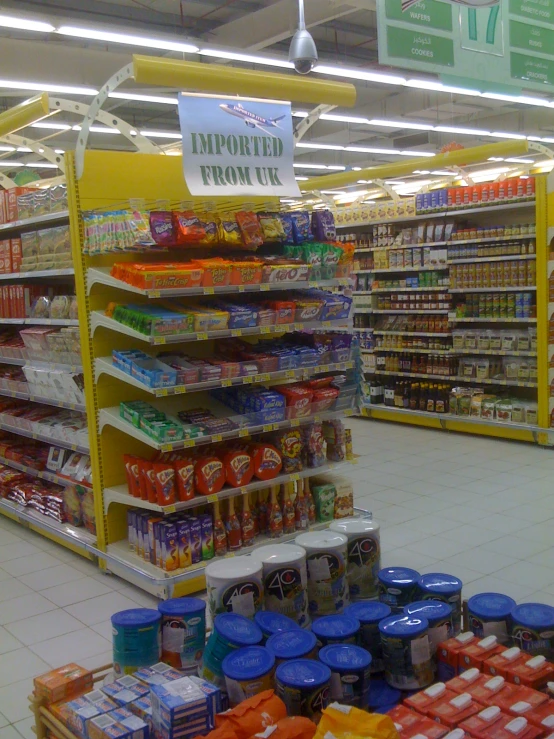 an empty grocery store aisle is full of food