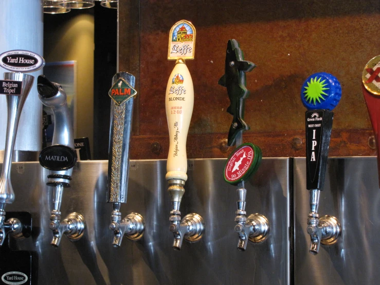 an assortment of beer taps in a bar