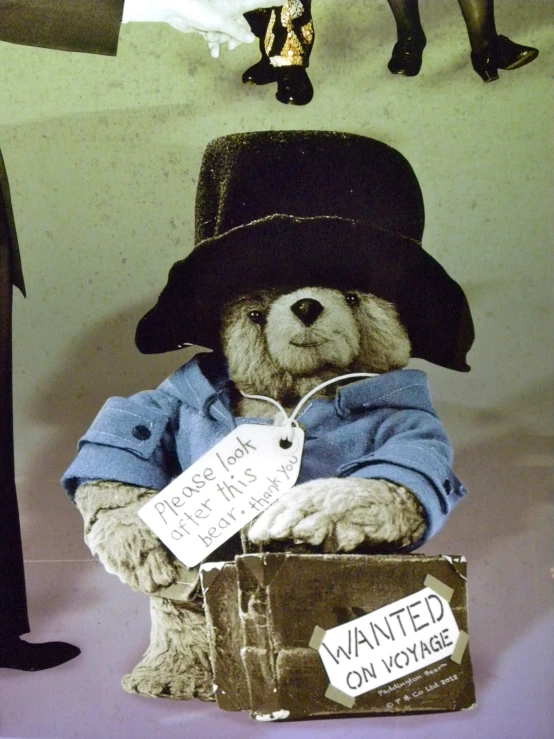 a stuffed teddy bear wearing a top hat