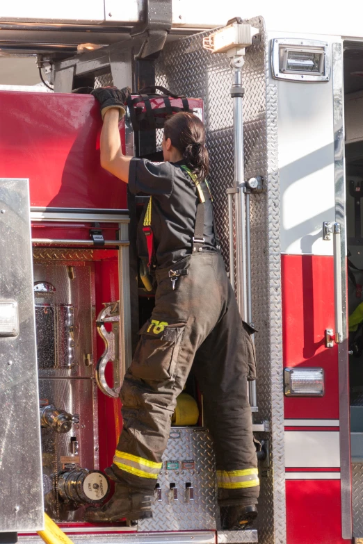 a fireman who is using a hand held device
