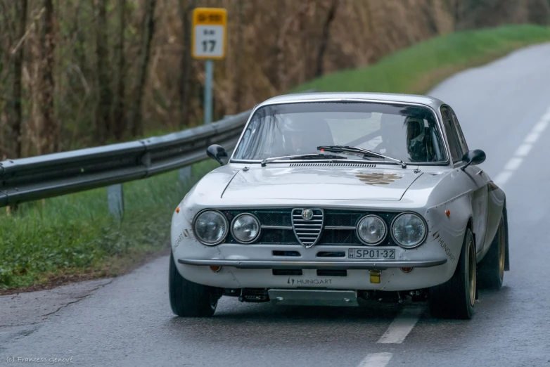 a car on a country road in the countryside