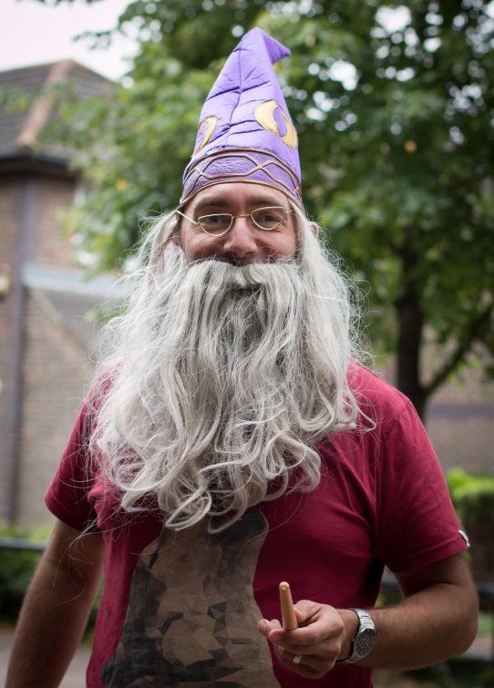 a man with a beard is dressed up like a viking